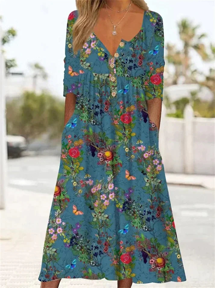 LP | Maxi pleated dress with floral pattern.