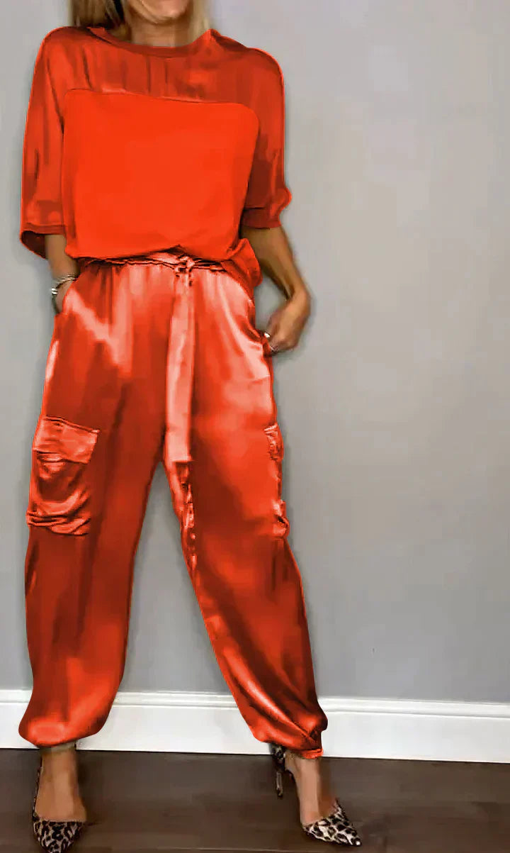 Two-piece costume of smooth satin with half-length top and half-length pants for women
