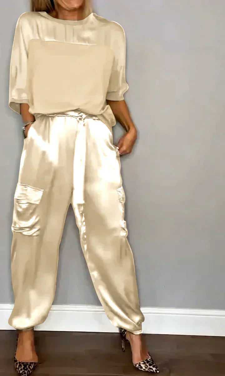 Two-piece costume of smooth satin with half-length top and half-length pants for women