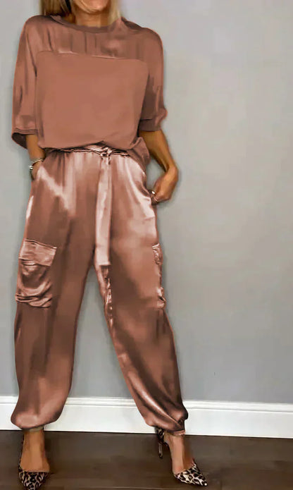 Two-piece costume of smooth satin with half-length top and half-length pants for women