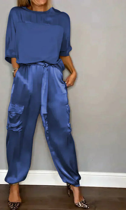 Two-piece costume of smooth satin with half-length top and half-length pants for women