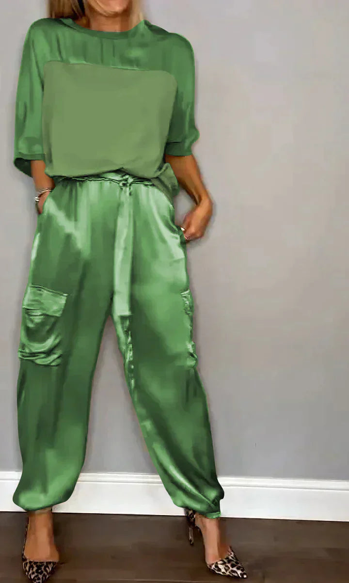 Two-piece costume of smooth satin with half-length top and half-length pants for women