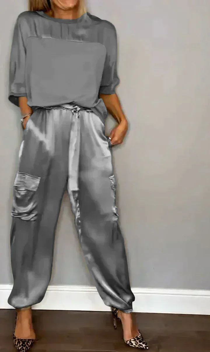 Two-piece costume of smooth satin with half-length top and half-length pants for women