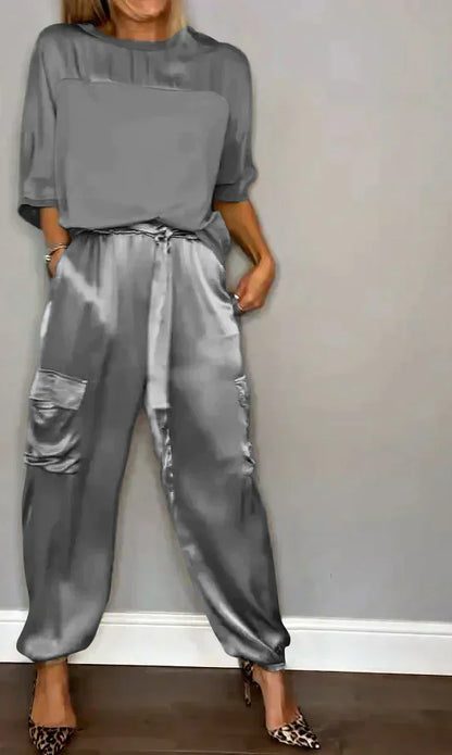 Two-piece costume of smooth satin with half-length top and half-length pants for women
