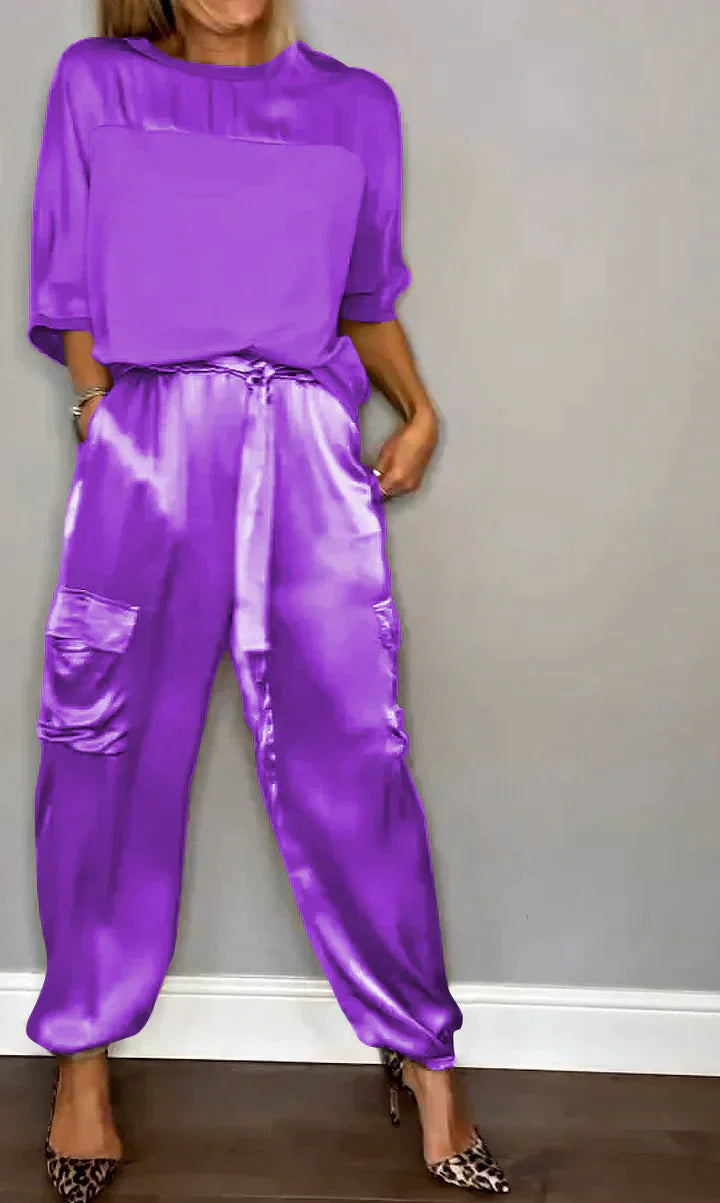 Two-piece costume of smooth satin with half-length top and half-length pants for women