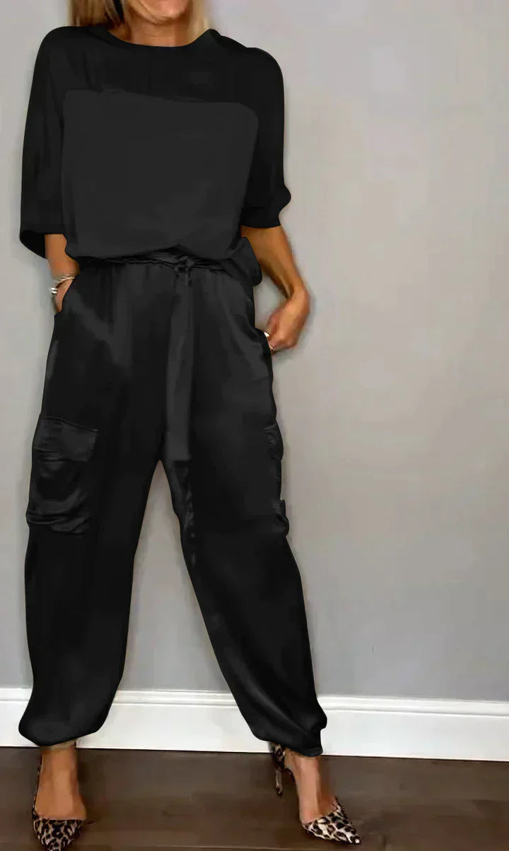 Two-piece costume of smooth satin with half-length top and half-length pants for women