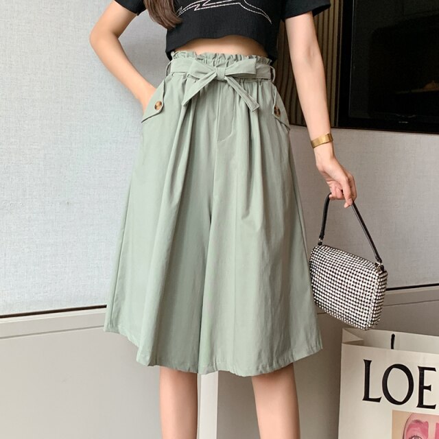 Thalassa - High-waisted pants draped from a mid-calf skirt