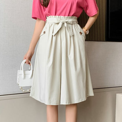 Thalassa - High-waisted pants draped from a mid-calf skirt